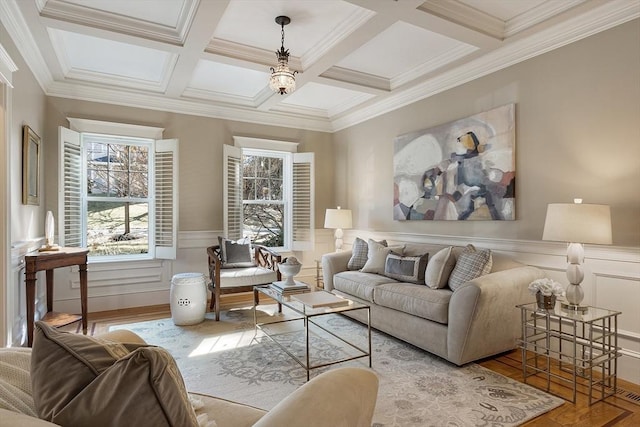 living room featuring beamed ceiling, coffered ceiling, wood finished floors, and wainscoting