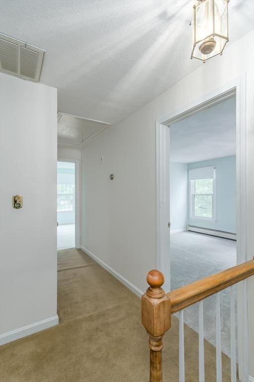 40 Langley Ln, Tewksbury, MA 01876 - hallway featuring attic access, carpet floors, a baseboard radiator, and baseboards