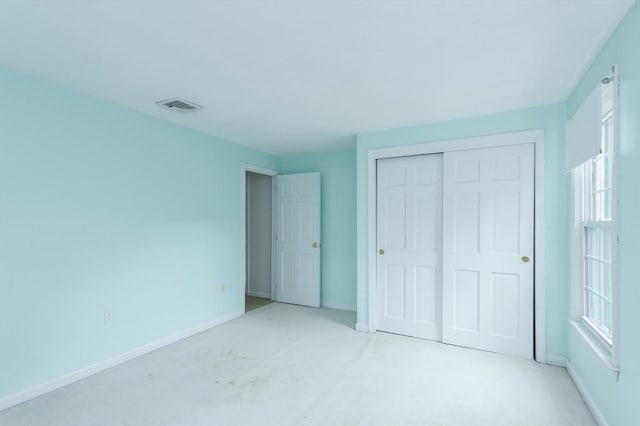 40 Langley Ln, Tewksbury, MA 01876 - unfurnished bedroom featuring a closet, carpet floors, and baseboards