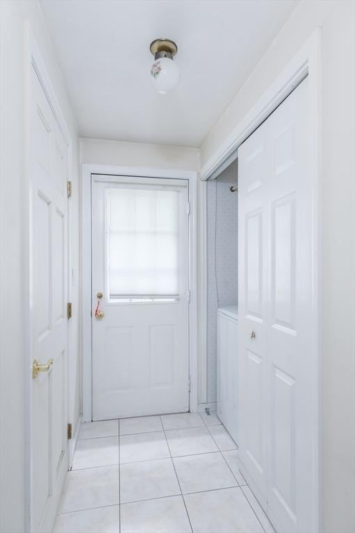 40 Langley Ln, Tewksbury, MA 01876 - corridor featuring light tile patterned floors and washer / dryer