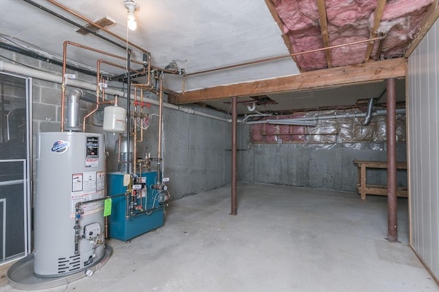 40 Langley Ln, Tewksbury, MA 01876 - unfinished below grade area with gas water heater and a heating unit