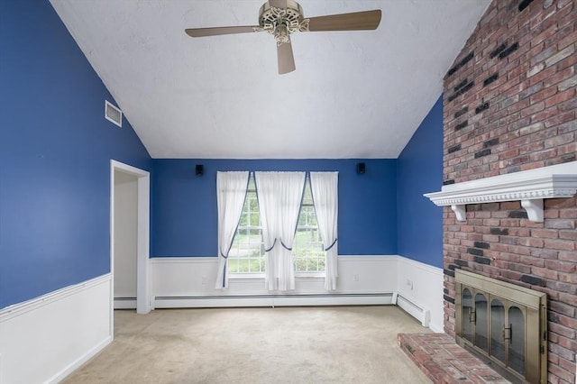 40 Langley Ln, Tewksbury, MA 01876 - unfurnished living room with vaulted ceiling, carpet flooring, ceiling fan, a wainscoted wall, and a textured ceiling