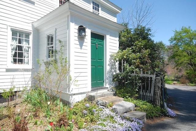 property entrance with fence