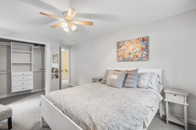 bedroom with a closet, carpet flooring, ceiling fan, and baseboards