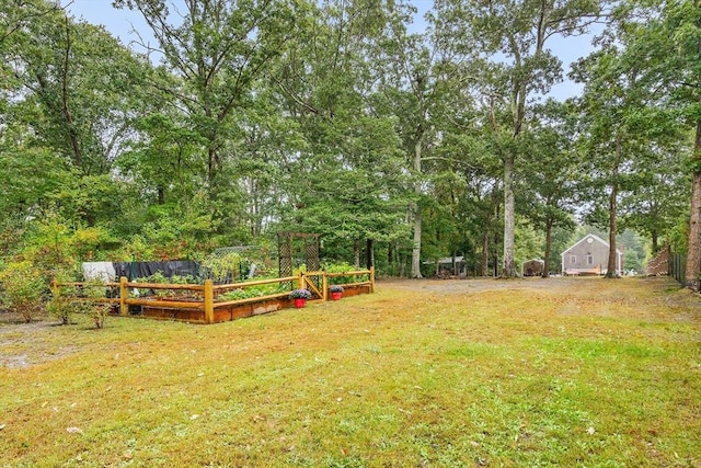 view of yard with a garden and fence