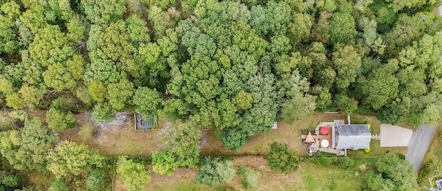 bird's eye view featuring a wooded view