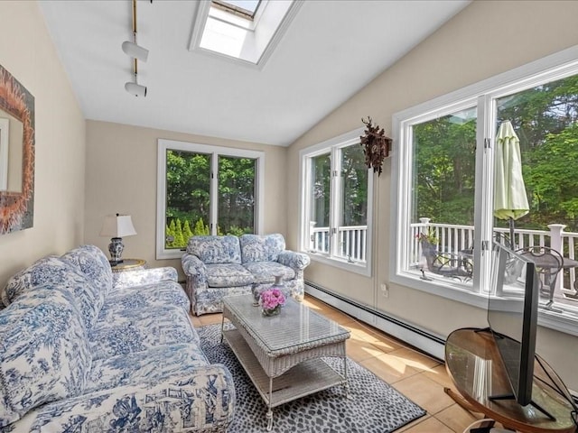 55 Dwight St, Dedham, MA 02026 - living room with a baseboard radiator, a skylight, track lighting, vaulted ceiling, and light tile patterned floors