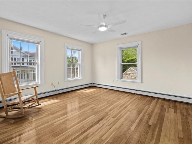55 Dwight St, Dedham, MA 02026 - unfurnished room with light wood finished floors, plenty of natural light, and a ceiling fan
