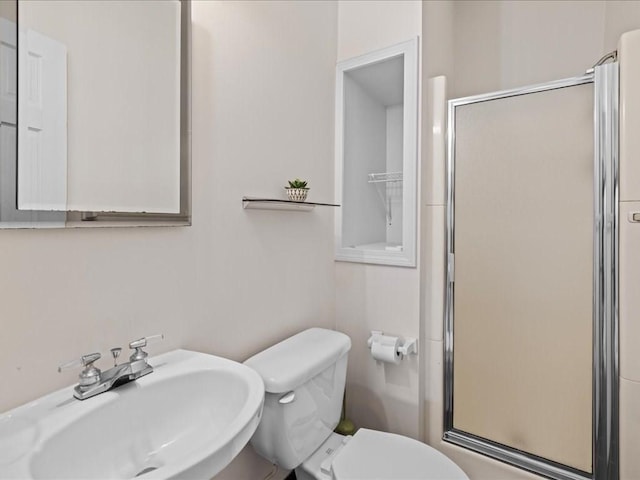 55 Dwight St, Dedham, MA 02026 - bathroom featuring a sink, a stall shower, and toilet