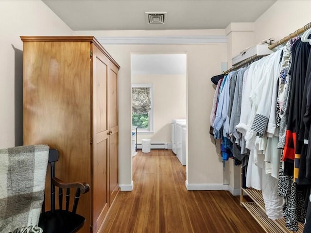 55 Dwight St, Dedham, MA 02026 - walk in closet with wood finished floors and baseboard heating