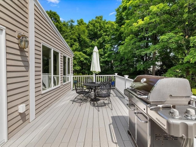 55 Dwight St, Dedham, MA 02026 - deck featuring outdoor dining area, a grill, and view of scattered trees