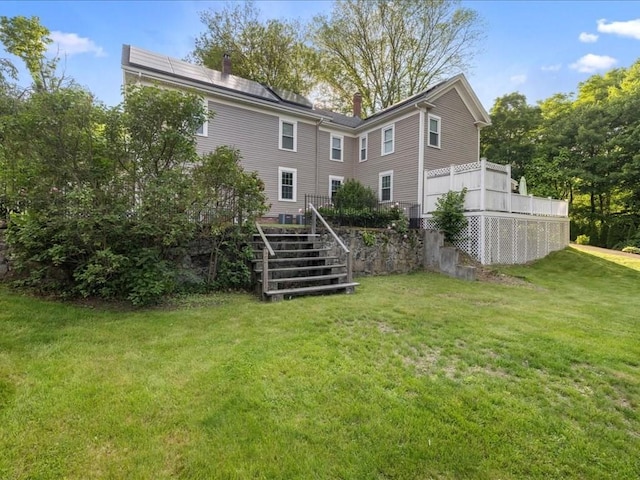 55 Dwight St, Dedham, MA 02026 - back of house with stairs, a lawn, and a chimney