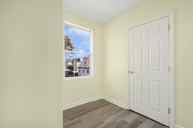 empty room with hardwood / wood-style floors