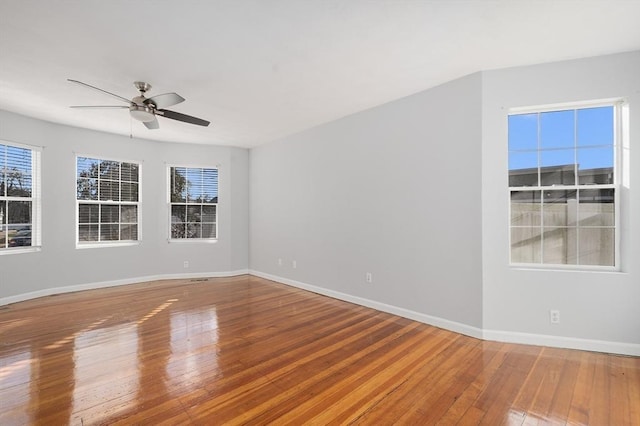 unfurnished room featuring hardwood / wood-style flooring and ceiling fan