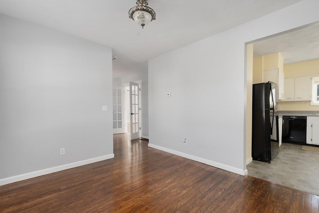 spare room featuring hardwood / wood-style flooring