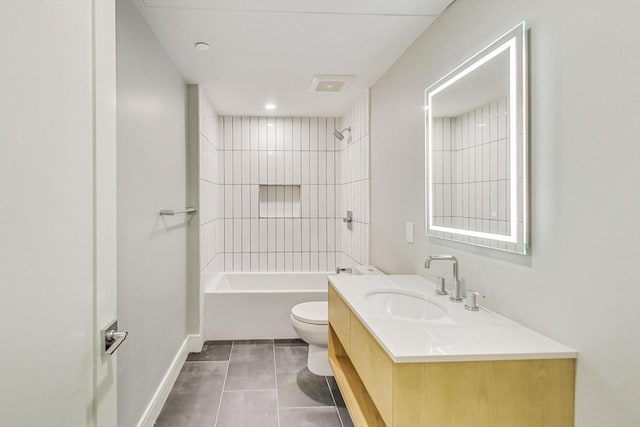 full bathroom with shower / bathing tub combination, toilet, vanity, baseboards, and tile patterned floors