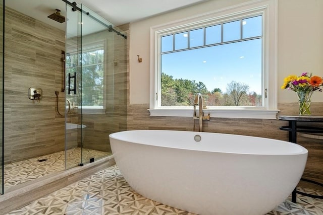 619 Main St, Hanover, MA 02339 - full bathroom featuring plenty of natural light, tile walls, and a stall shower