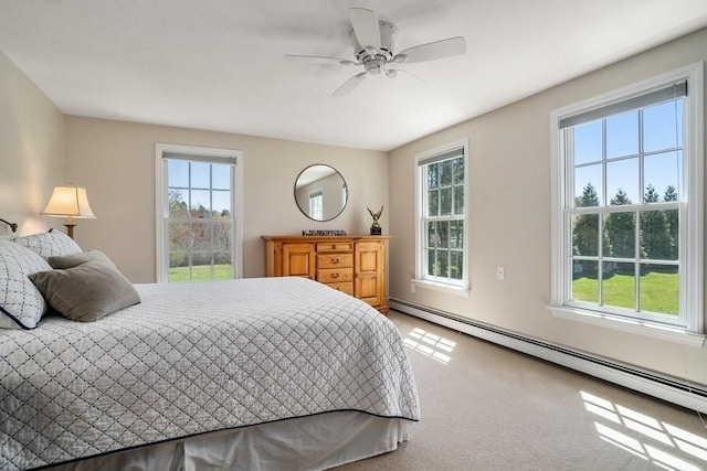 619 Main St, Hanover, MA 02339 - bedroom with baseboard heating, multiple windows, carpet, and ceiling fan