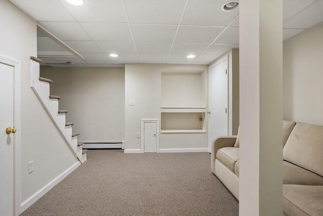619 Main St, Hanover, MA 02339 - finished basement with a baseboard heating unit, a drop ceiling, carpet, stairs, and recessed lighting