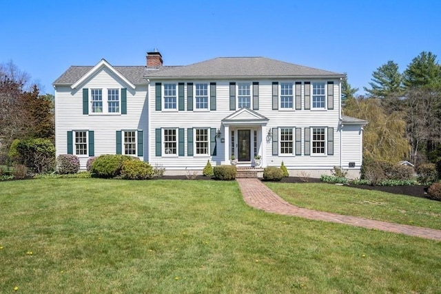 619 Main St, Hanover, MA 02339 - colonial home featuring a chimney and a front yard
