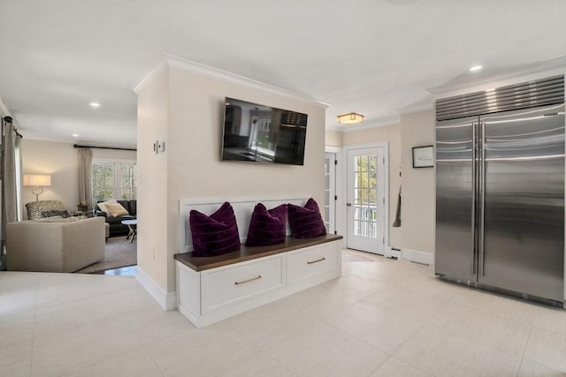 619 Main St, Hanover, MA 02339 - kitchen with stainless steel built in fridge, dark countertops, crown molding, baseboards, and white cabinets