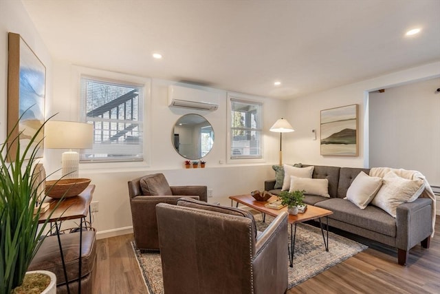 living room with a wall mounted air conditioner and dark hardwood / wood-style flooring