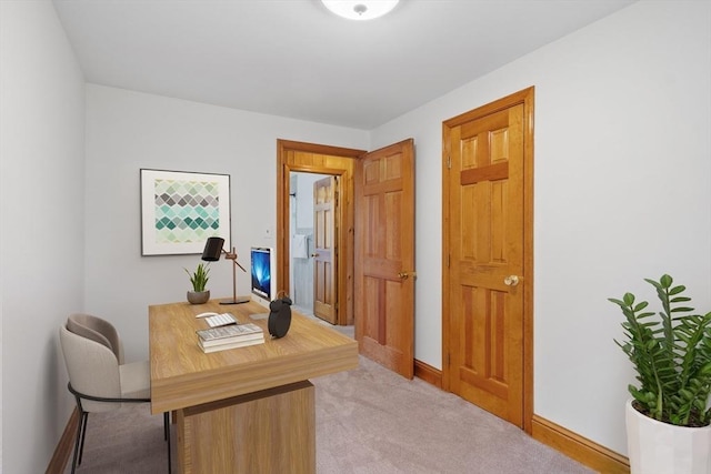 home office with carpet floors and baseboards