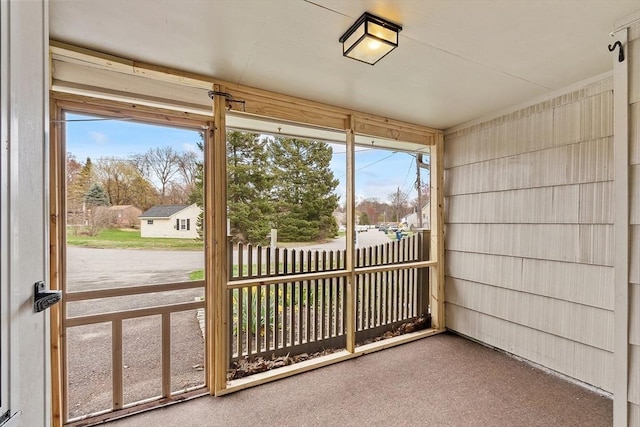 unfurnished sunroom featuring a wealth of natural light