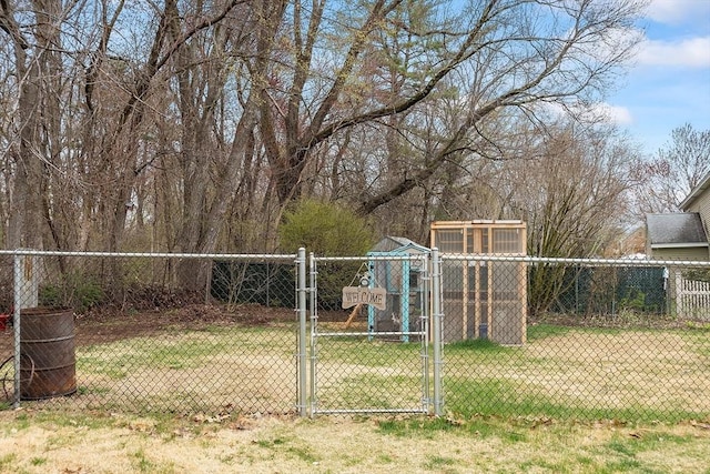 view of yard with fence and a gate