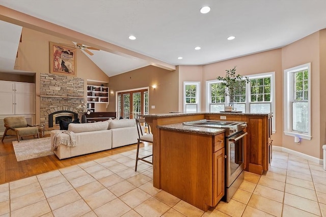 26 Sam Cobb Ln, Princeton, MA 01541 - kitchen featuring electric stove, brown cabinetry, a breakfast bar area, stone countertops, and a ceiling fan