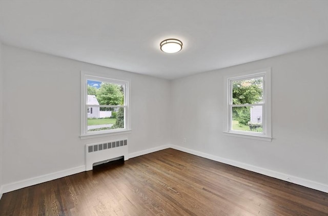 69 Notre Dame St, Springfield, MA 01104 - unfurnished room with radiator heating unit, wood finished floors, and baseboards