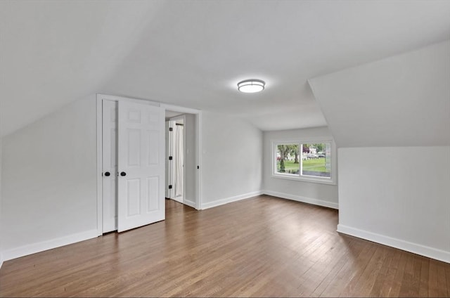 69 Notre Dame St, Springfield, MA 01104 - additional living space featuring wood finished floors, vaulted ceiling, and baseboards