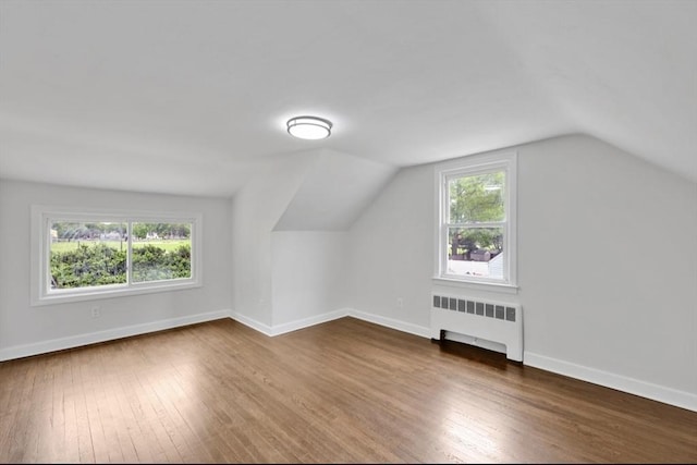 69 Notre Dame St, Springfield, MA 01104 - bonus room featuring radiator heating unit, wood finished floors, plenty of natural light, lofted ceiling, and baseboards