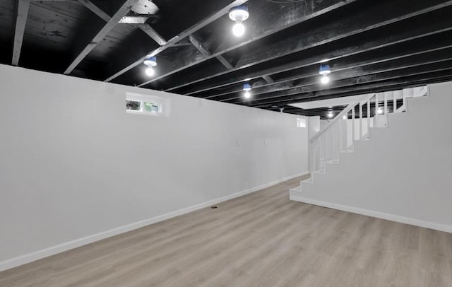 69 Notre Dame St, Springfield, MA 01104 - basement with wood finished floors, stairs, and baseboards