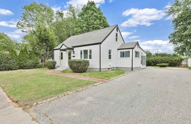 69 Notre Dame St, Springfield, MA 01104 - view of front of house with a front yard, roof with shingles, and driveway