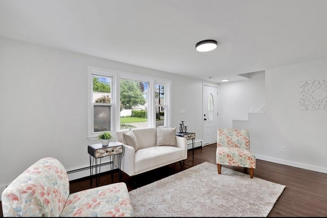69 Notre Dame St, Springfield, MA 01104 - living area featuring a baseboard radiator, dark wood finished floors, stairs, and baseboards