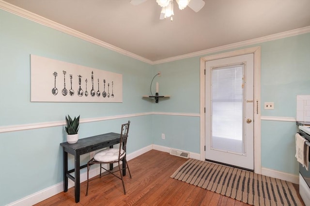 office space featuring crown molding, wood-type flooring, and ceiling fan