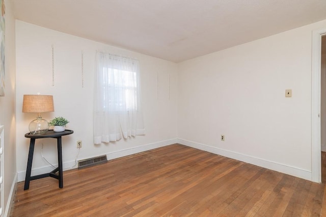 empty room featuring hardwood / wood-style floors