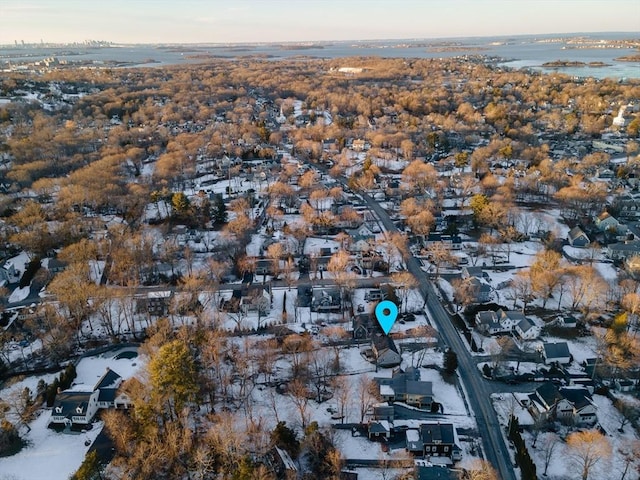 aerial view at dusk with a water view