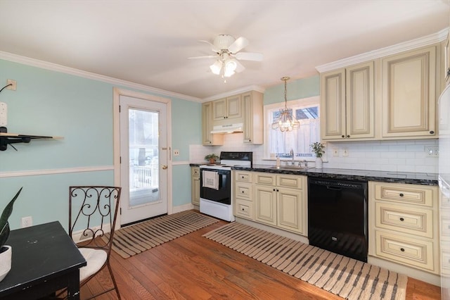 kitchen with pendant lighting, white electric range, dishwasher, and cream cabinetry