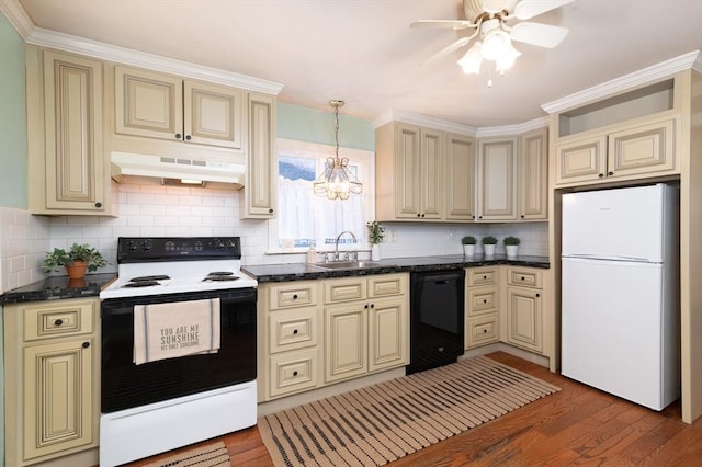 kitchen with sink, electric range oven, white refrigerator, black dishwasher, and cream cabinets