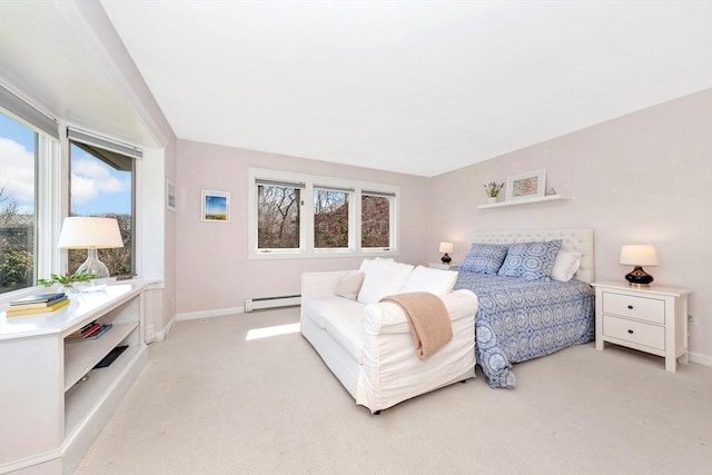 bedroom featuring baseboards, multiple windows, baseboard heating, and light carpet