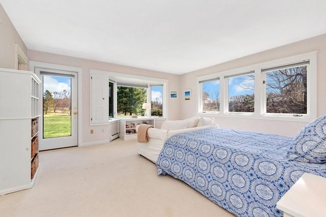 bedroom with access to outside, baseboards, baseboard heating, and carpet