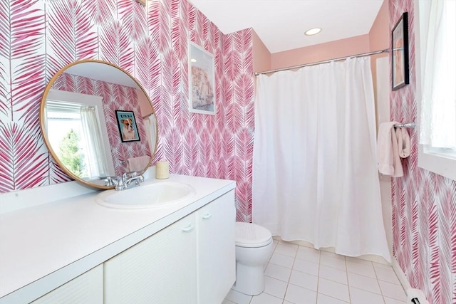bathroom featuring vanity, a wealth of natural light, toilet, and wallpapered walls