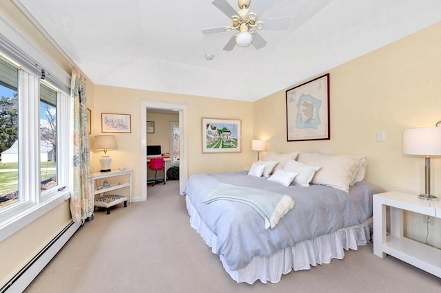 bedroom featuring baseboards, ceiling fan, baseboard heating, and carpet