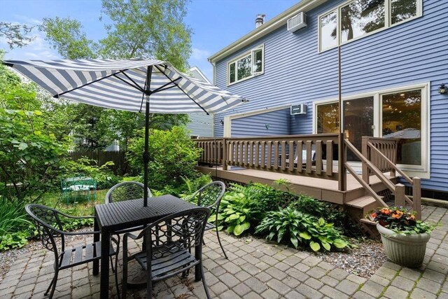 27 5th Ave Unit 27, Watertown, MA 02472 - view of patio with outdoor dining space, a wall unit AC, and a deck