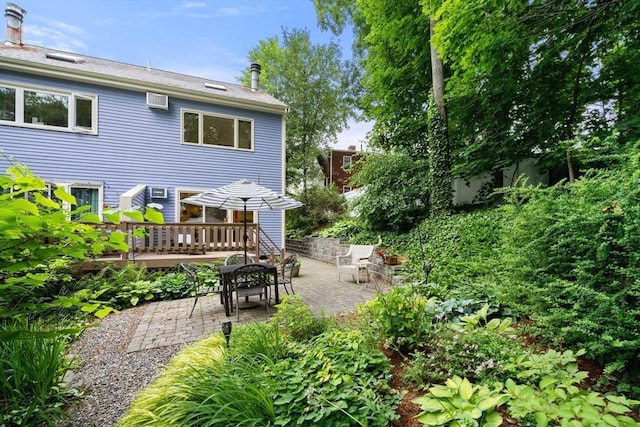 27 5th Ave Unit 27, Watertown, MA 02472 - back of property with a patio, a deck, and a wall unit AC