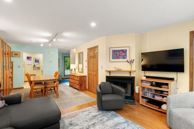 27 5th Ave Unit 27, Watertown, MA 02472 - living room with a fireplace, light wood-type flooring, and track lighting