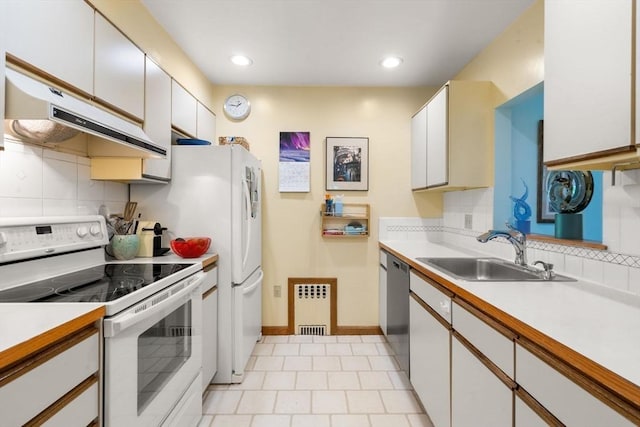 27 5th Ave Unit 27, Watertown, MA 02472 - kitchen with white range with electric stovetop, stainless steel dishwasher, under cabinet range hood, decorative backsplash, and light countertops