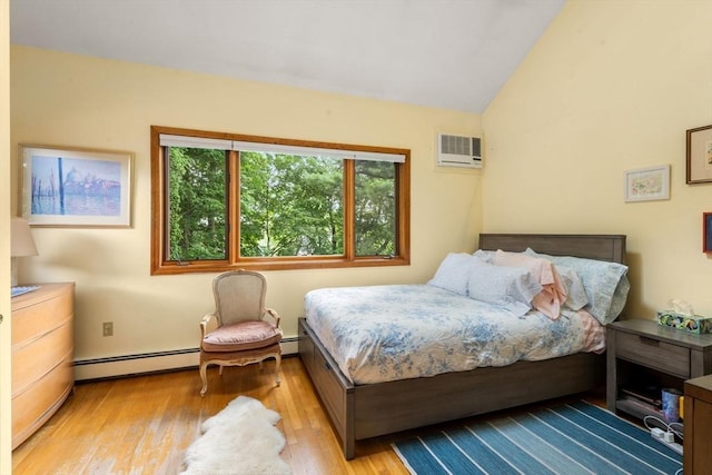 27 5th Ave Unit 27, Watertown, MA 02472 - bedroom featuring baseboard heating, wood finished floors, lofted ceiling, and a wall mounted air conditioner